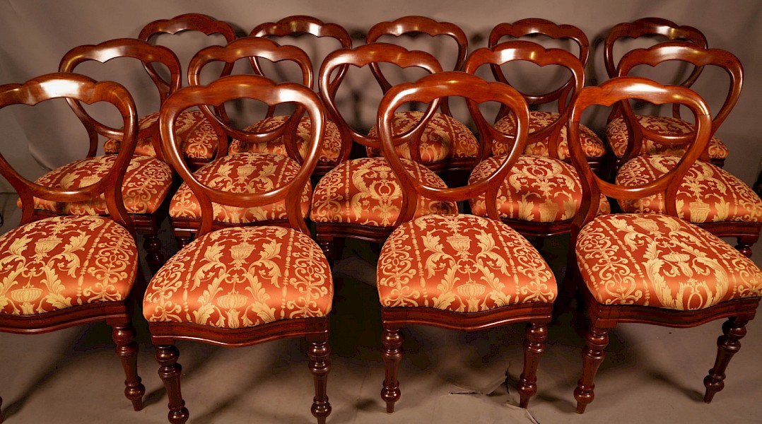 A Rare set of 16 Victorian Mahogany Balloon Back Dining Chairs