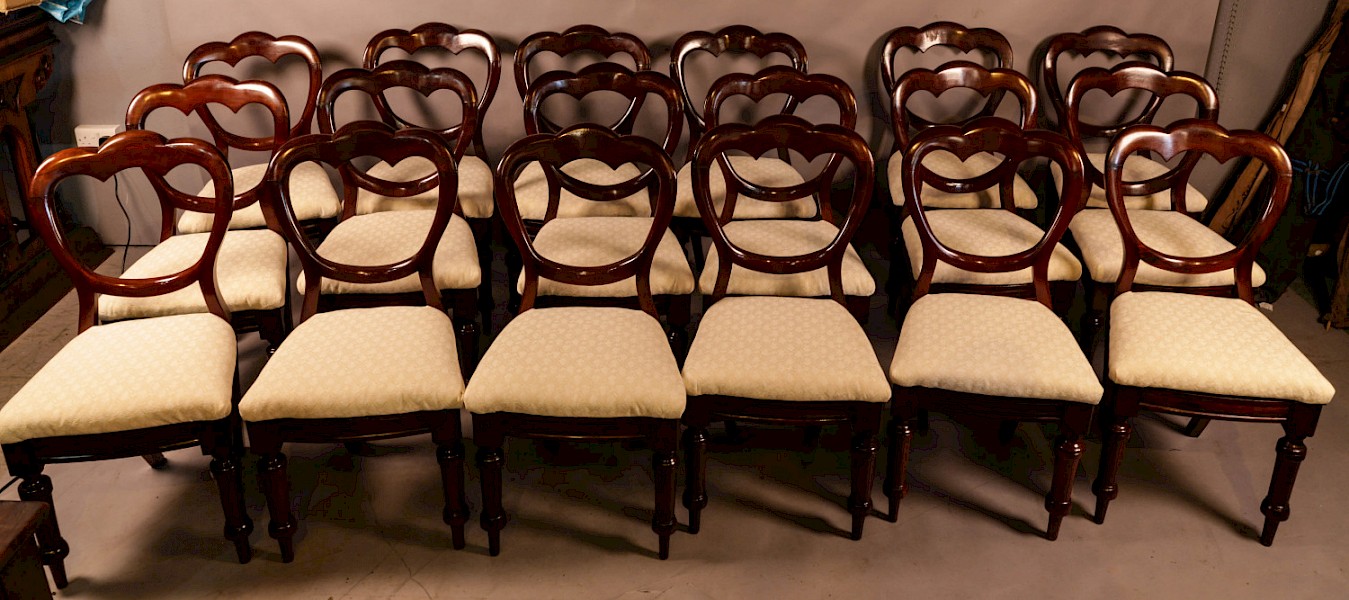 A Set of 18 Victorian Mahogany Balloon Back Dining Chairs