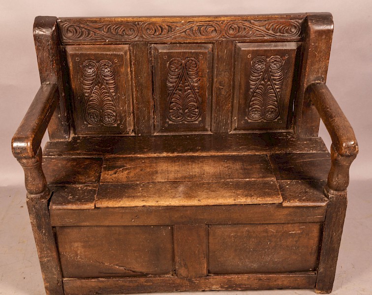 Early Oak Settle carved