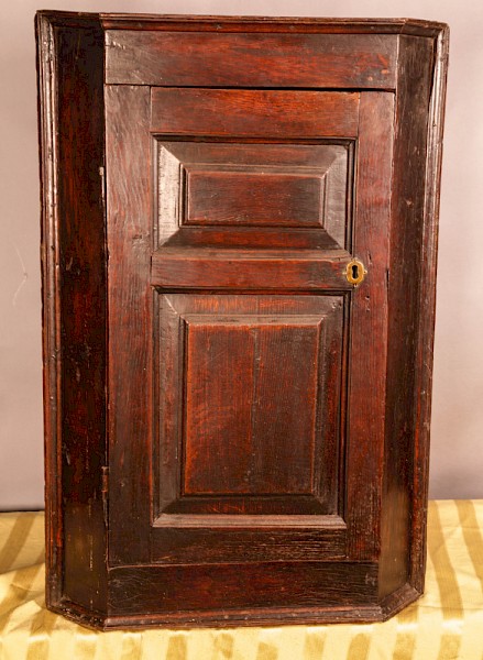 A Good Early Oak Corner Cupboard