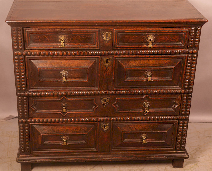 A 17th century moulded front chest of drawers in Oak
