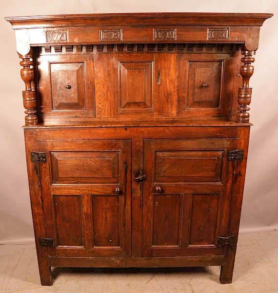 A Good 18th century court cupboard dated 1713