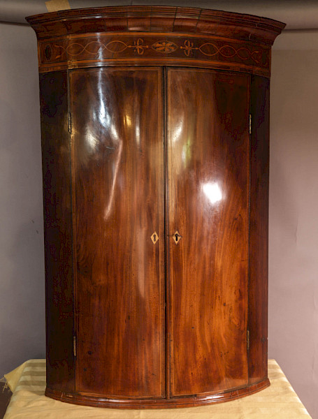 A Georgian Bow Front Corner cupboard Mahogany Inlaid
