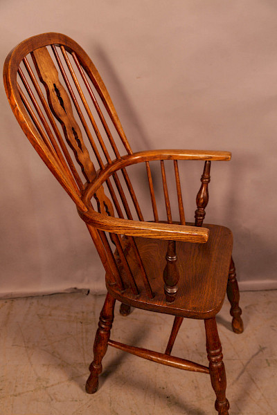 A Victorian High Back Windsor chair stick arm
