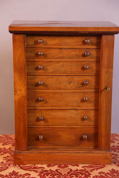 A Miniature Wellington Chest in Walnut