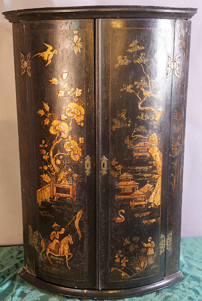 An early 18th century laqured Corner cupbord