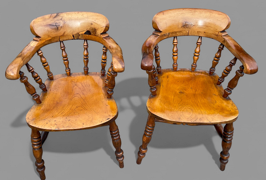 A rare pair of yew wood captains chairs  impressive quality